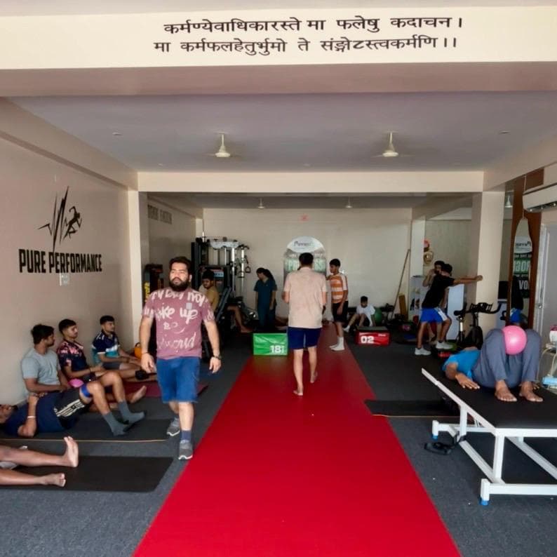 Wide view of the ACL PhysioHab clinic floor with patients performing supervised strength and mobility exercises